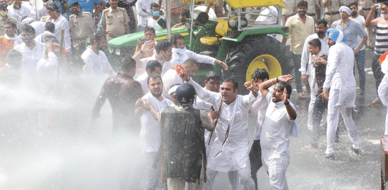 Indian Youth Congress president Srinivas B V also participated in the “tractor rally” which was stopped by the police at a barricade in Panipat district. However, when some workers tried to cross the barricade, police used water cannon to disperse them. Credit: Twitter/@srinivasiyc