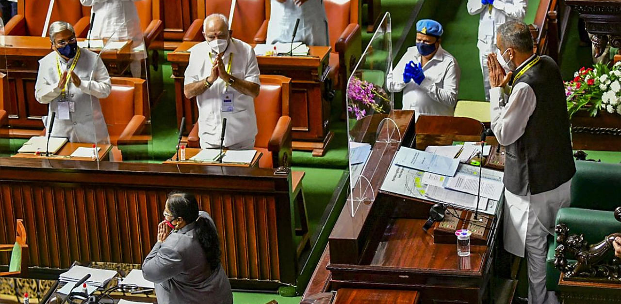 Karnataka CM B S Yediyurappa (C) and other legislators greet Speaker Vishweshwar Hegde Kageri (L) during the ongoing Monsoon Session of State Assembly. Credit: PTI