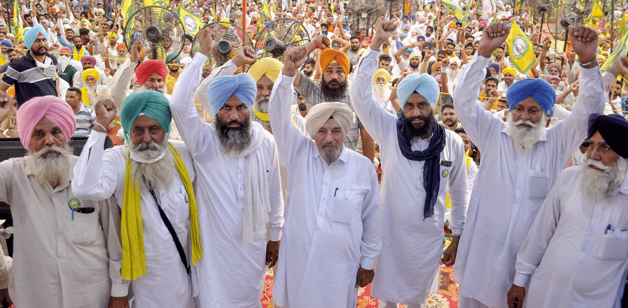 Representatives of various farmers' organisations stage a protest against the Central government over agriculture related issues, in Patiala. Credit: PTI Photo