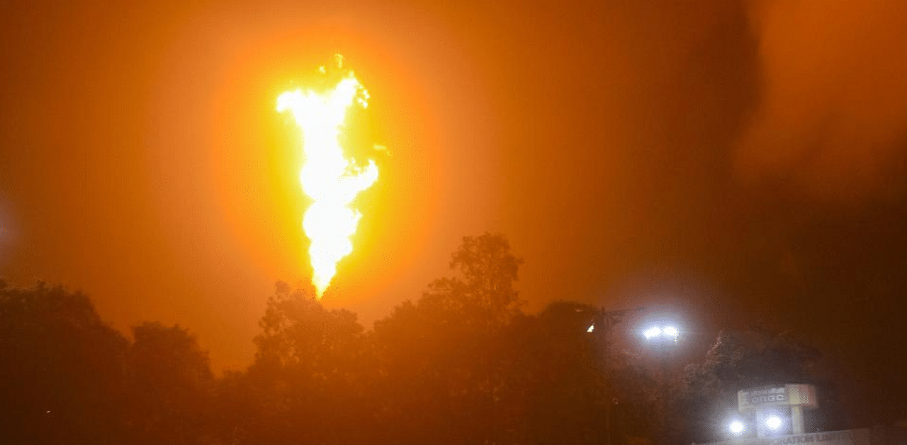 Flames rise from Oil and Natural Gas Corporation. Credit: PTI