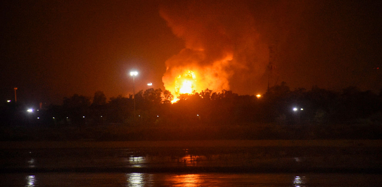 Flames rise from Oil and Natural Gas Corporation (ONGC) plant after a fire broke out in it in the wee hours, in Surat. Credit: PTI Photo