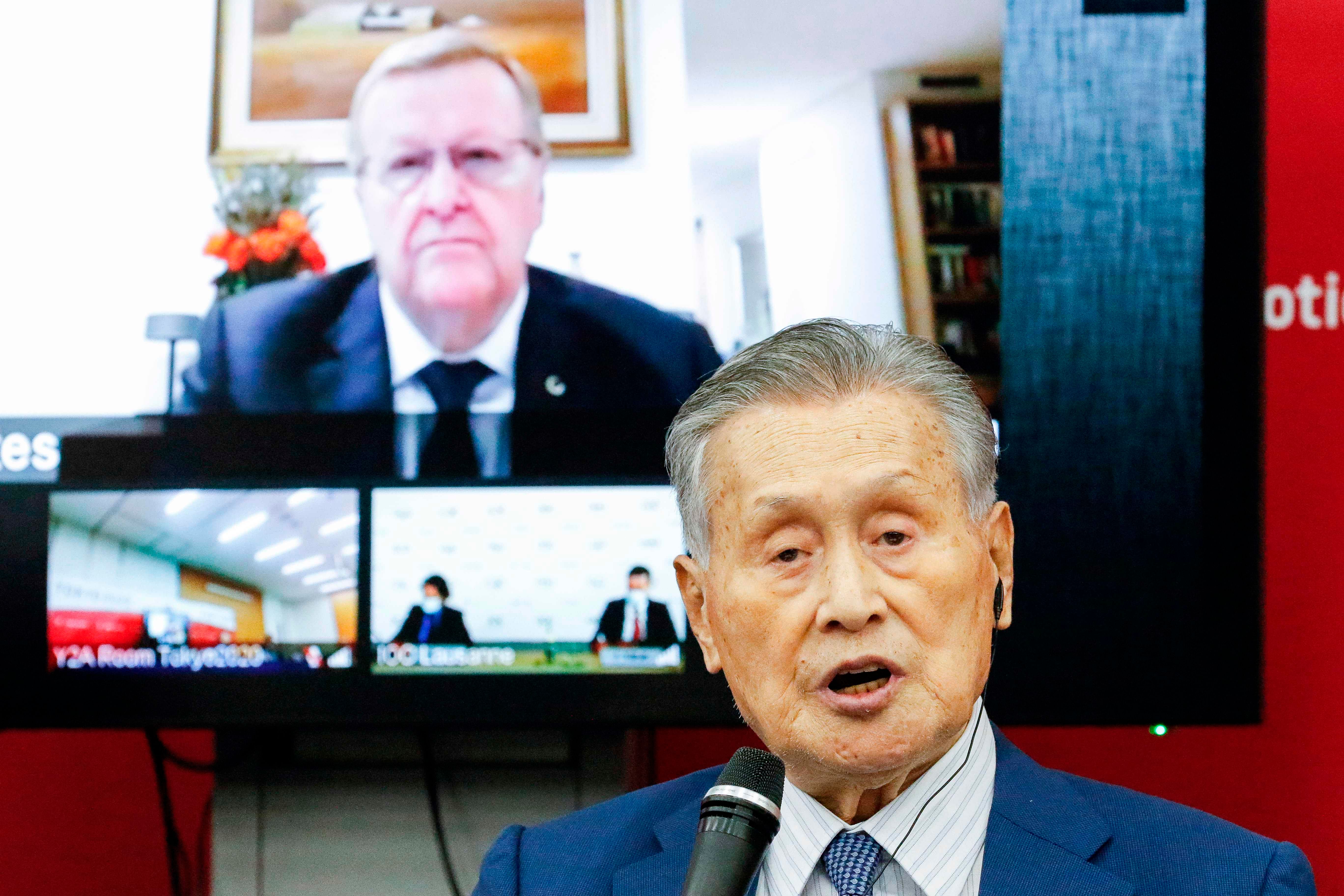 President of the Tokyo 2020 Organising Committee Yoshiro Mori speaks in front of a screen showing chairman of the Tokyo 2020 Olympic Games coordination committee John Coates. Credits: AFP Photo
