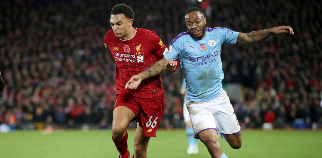 Liverpool's Trent Alexander-Arnold in action with Manchester City's Raheem Sterling. Credit: Reuters