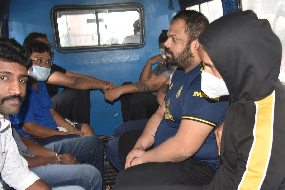Rahul Thonse and other suspects in the drugs case being taken for a medical test in Bengaluru on September 14. DH FILE PHOTO/S K DINESH