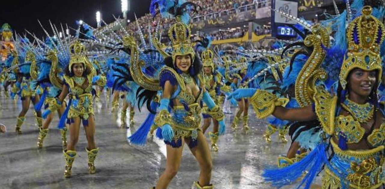 Members of Vila Isabel samba school perform during the last night of Rio's Carnival parade at the Sambadrome Marques de Sapucai in Rio de Janeiro, Brazil. Credit: AFP Photo