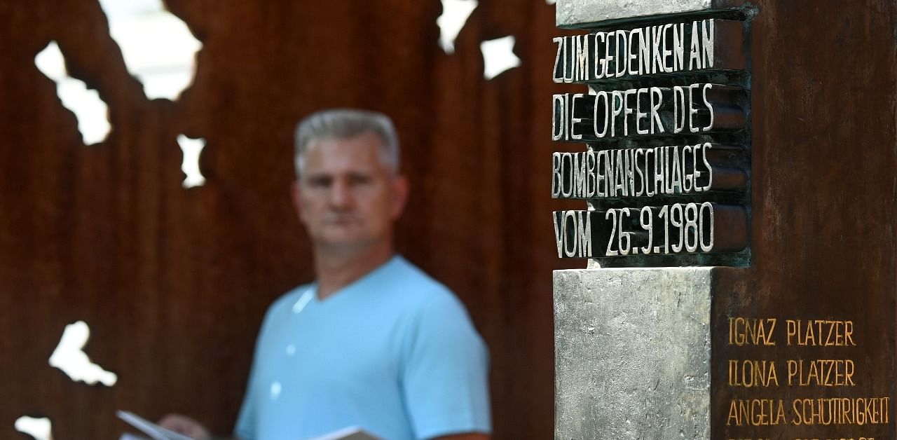 Robert Hoeckmayr, a survivor of the Oktoberfest attack of Munich in 1980, poses at the memorial of the attack at the Theresienwiese in Munich. Credit: AFP Photo