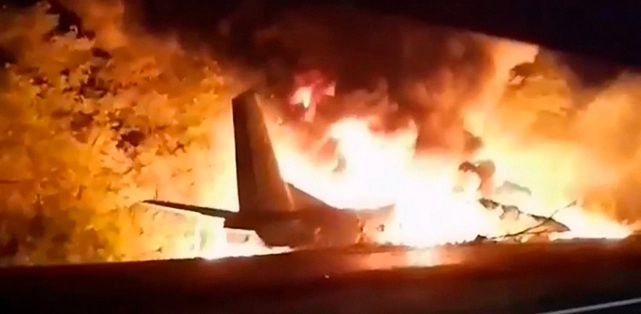 In this TV grab released by Ukraine's Emergency Situation Ministry, an AN-26 military plane bursts into flames after it crashed in the town of Chuguyiv close to Kharkiv, Ukraine. Credit: AP Photo