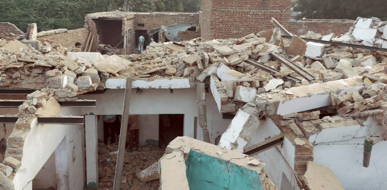Debris of a house which was stocked with items used to manufacture crackers, after an explosion took place in it, at Surir village in Mathura. Credit: PTI Photo