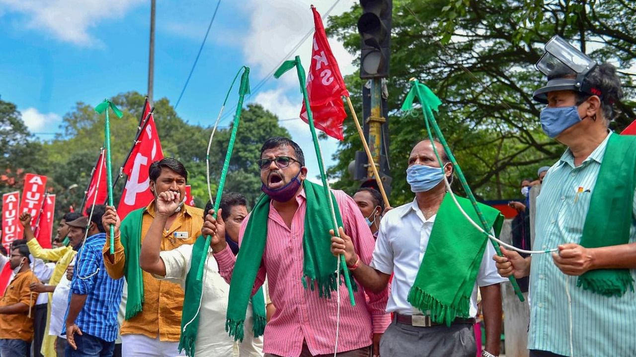 Members of various farmer organisations shout slogans during 'Bharat Bandh', a protest against the farm bills passed in Parliament recently, in Bengaluru. Credit: PTI.