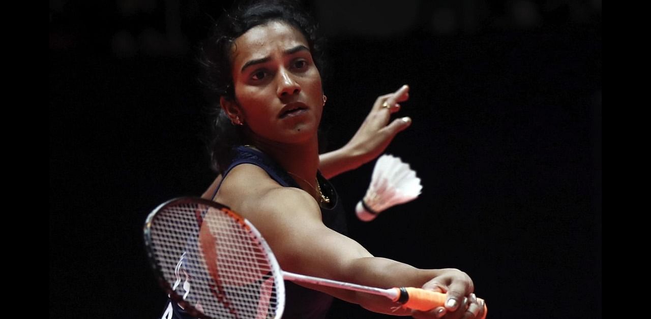  India's Pusarla V. Sindhu hits a return shot against China's He Bing Jiao during their women's singles badminton match at the World Tour Finals in Guangzhou in south China's Guangdong province. Credit: AP
