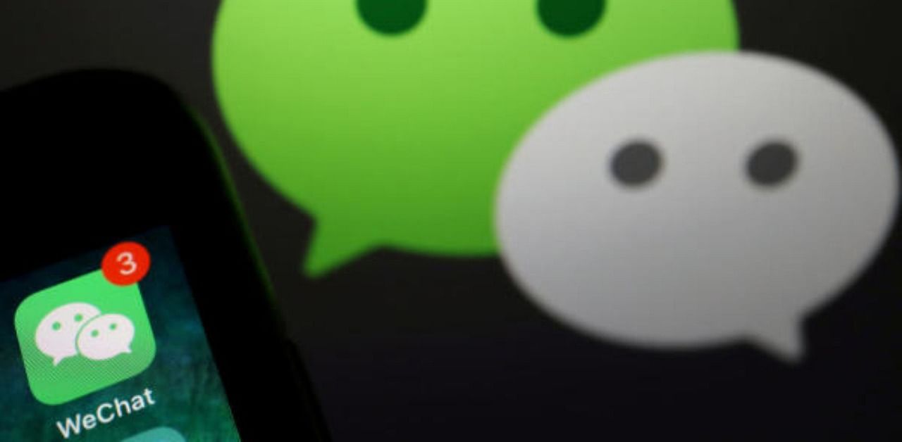 The messenger app WeChat is seen next to its logo. Credit: Reuters Photo