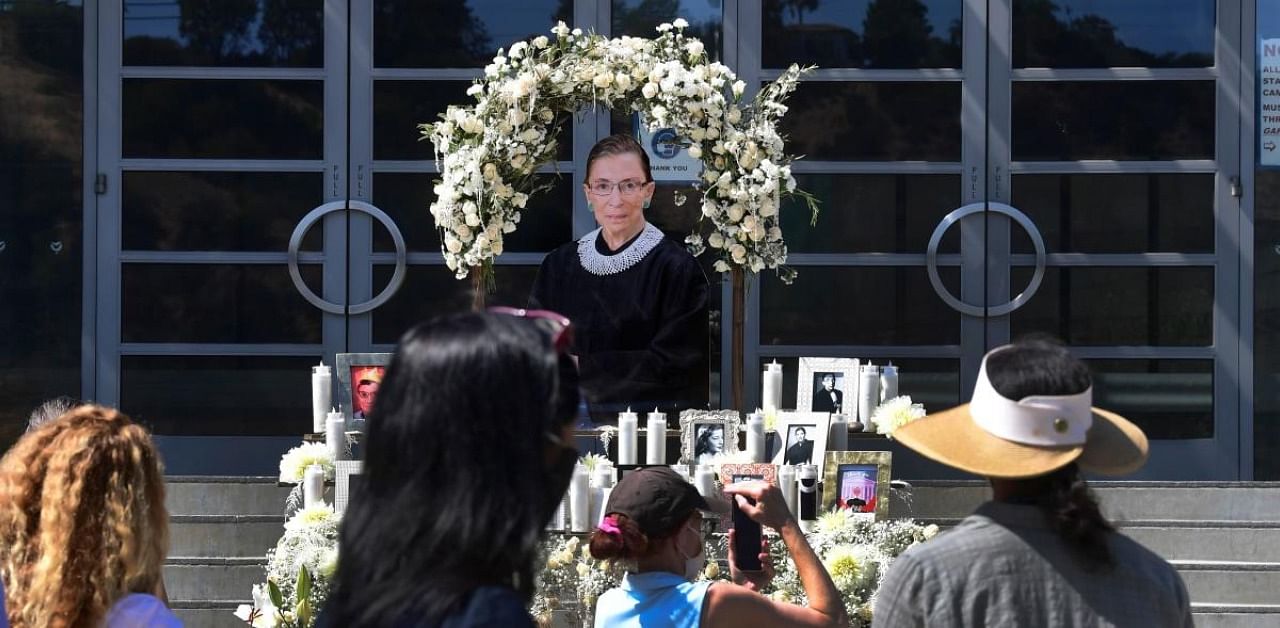 Visitors pay their respects at a memorial for Ruth Bader Ginsburg. Credit: AFP Photo