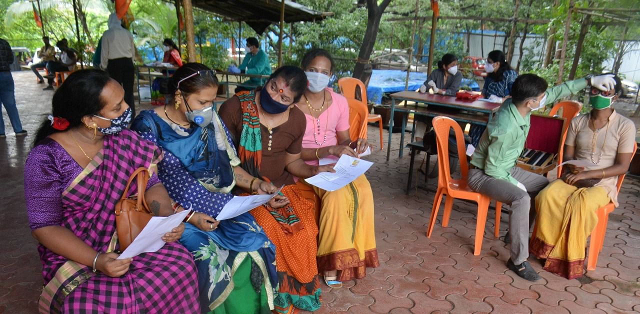 Members of the transgender community wait for their turn to give samples for Covid-19 Rapid Antigen test. Credit: PTI Photo