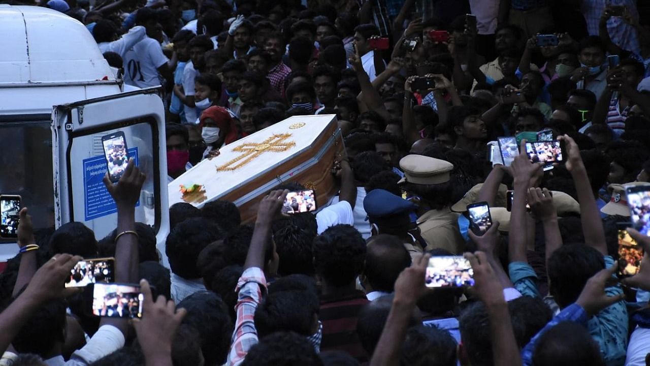 In this picture taken on June 26, 2020, residents gather as they carry the coffin of Jayaraj, 58, and son Bennicks Immanuel, 31, allegedly tortured at the hands of police in Sathankulam, Thoothukudi district in Tamil Nadu. Credit: AFP.