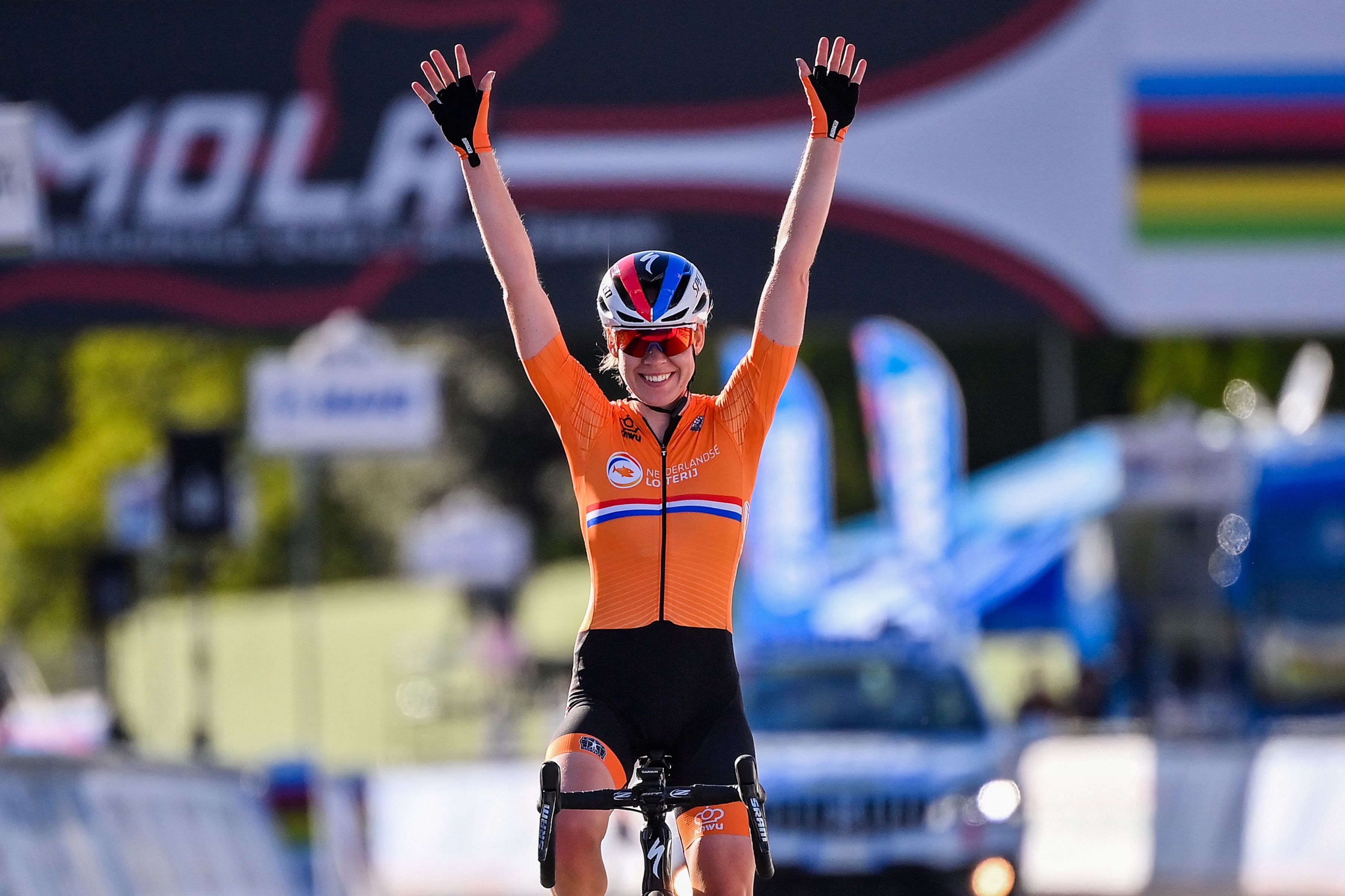Netherlands' Anna van der Breggen celebrates as she crosses the finish line to win the Women's Elite Road Race, a 143-kilometer route around Imola, Emilia-Romagna, Italy, on September 26, 2020 as part of the UCI 2020 Road World Championships. Credit: AFP