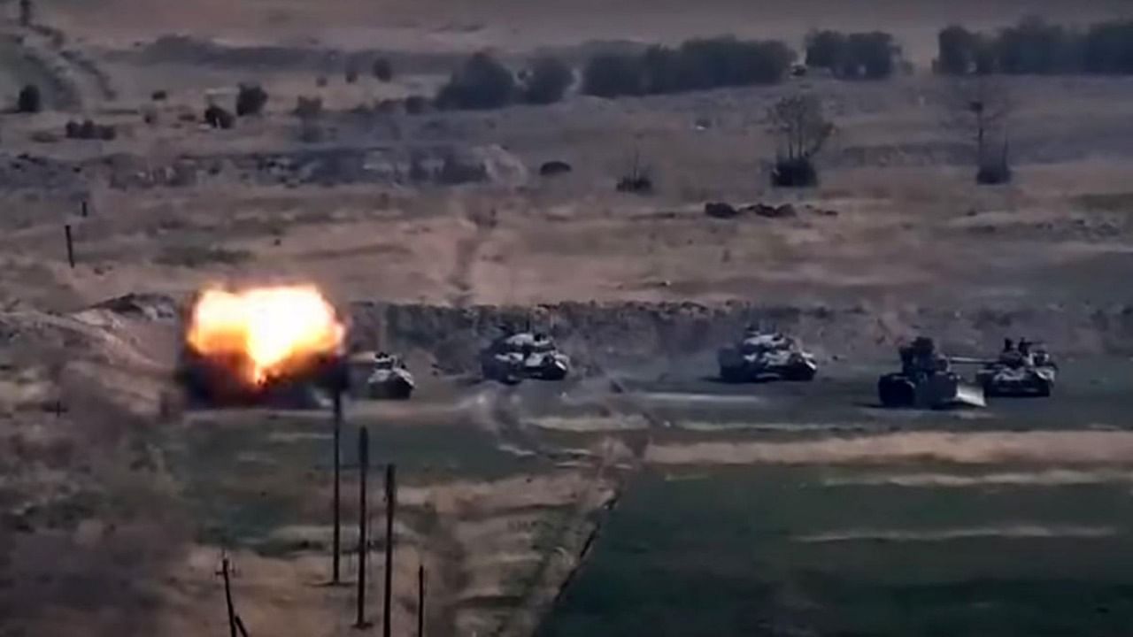 An image grab taken from a video made available on the official web site of the Armenian Defence Ministry on September 27, 2020, allegedly shows destroying of Azeri military vehicles during clashes between Armenian separatists and Azerbaijan in the breakaway region of Nagorno-Karabakh. Photo by Handout / Armenian Defence Ministry / AFP