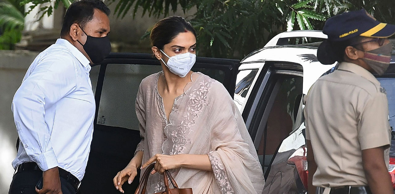 Bollywood actress Deepika Padukone (C) arrives to attend questioning by Narcotics Control Bureau (NCB) officials, in Mumbai on September 26, 2020. Credit: AFP Photo