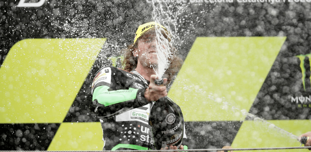 CIP Green Power's Darryn Binder celebrates with sparkling wine on the podium after winning the Moto3 race. Credit: Reuters Photo