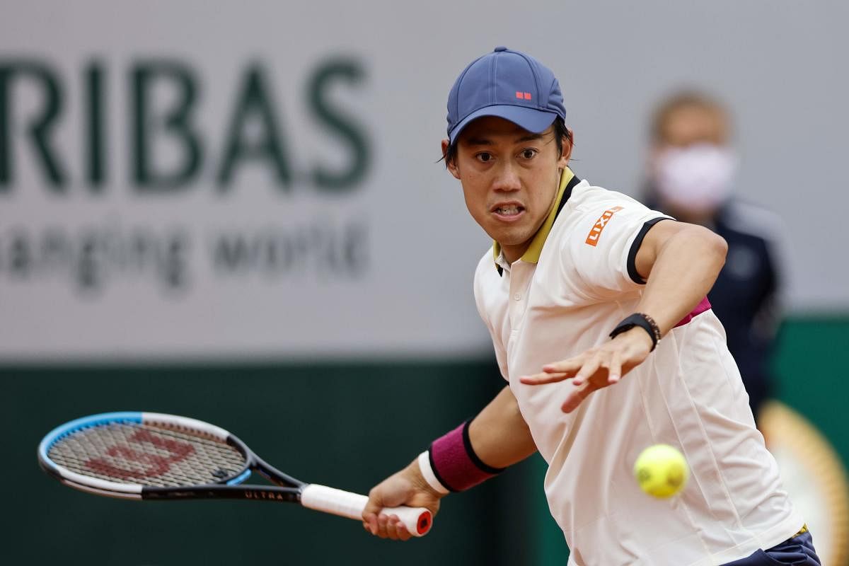 Japan's Kei Nishikori plays a forehand return to Britain's Daniel Evans during their men's singles first round tennis match on Day 1 of The Roland Garros 2020. Credit: AFP