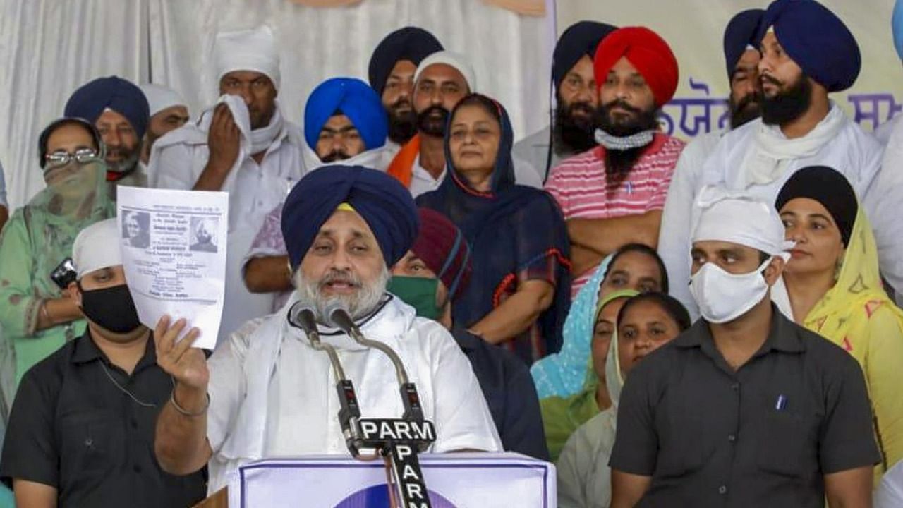 Shiromani Akali Dal President Sukhbir Singh Badal addresses a gathering of party workers and farmers to mobilise them for October 1 Kisan March, which would commence from all three Sikh religious Takhts in the state to Mohali. Credit: PTI.