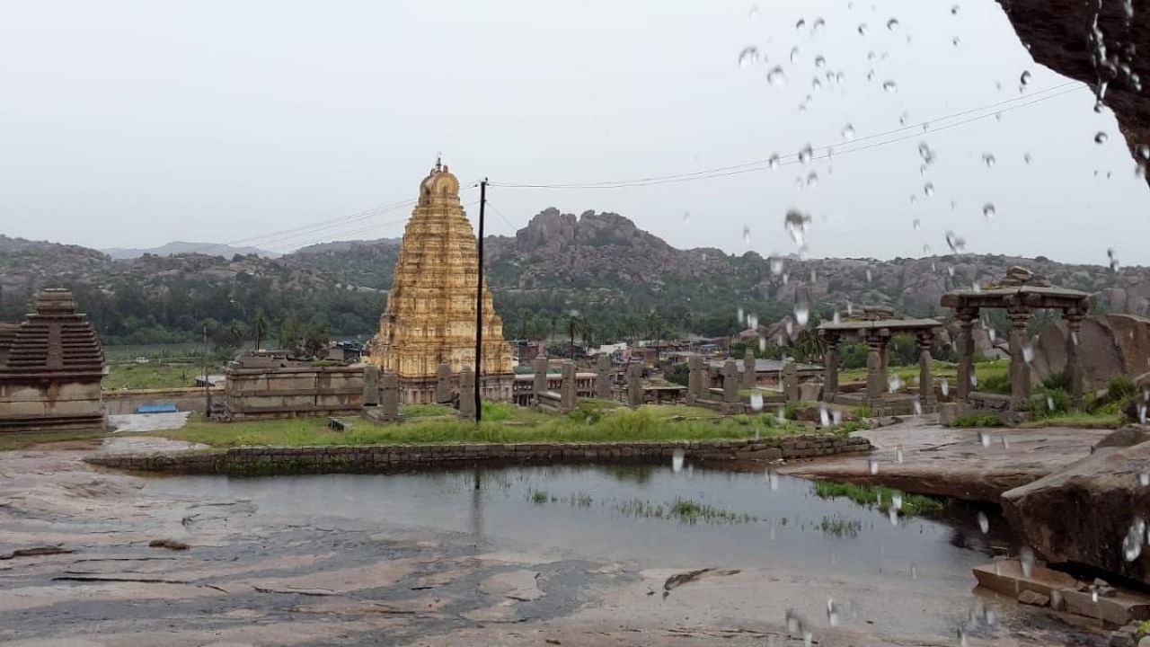 A view of rain soaked Virupaksha Temple at Hampi in Ballari district. The Unesco world heritage site has been seeing an unusually prolonged wet weather. Credit: DH.