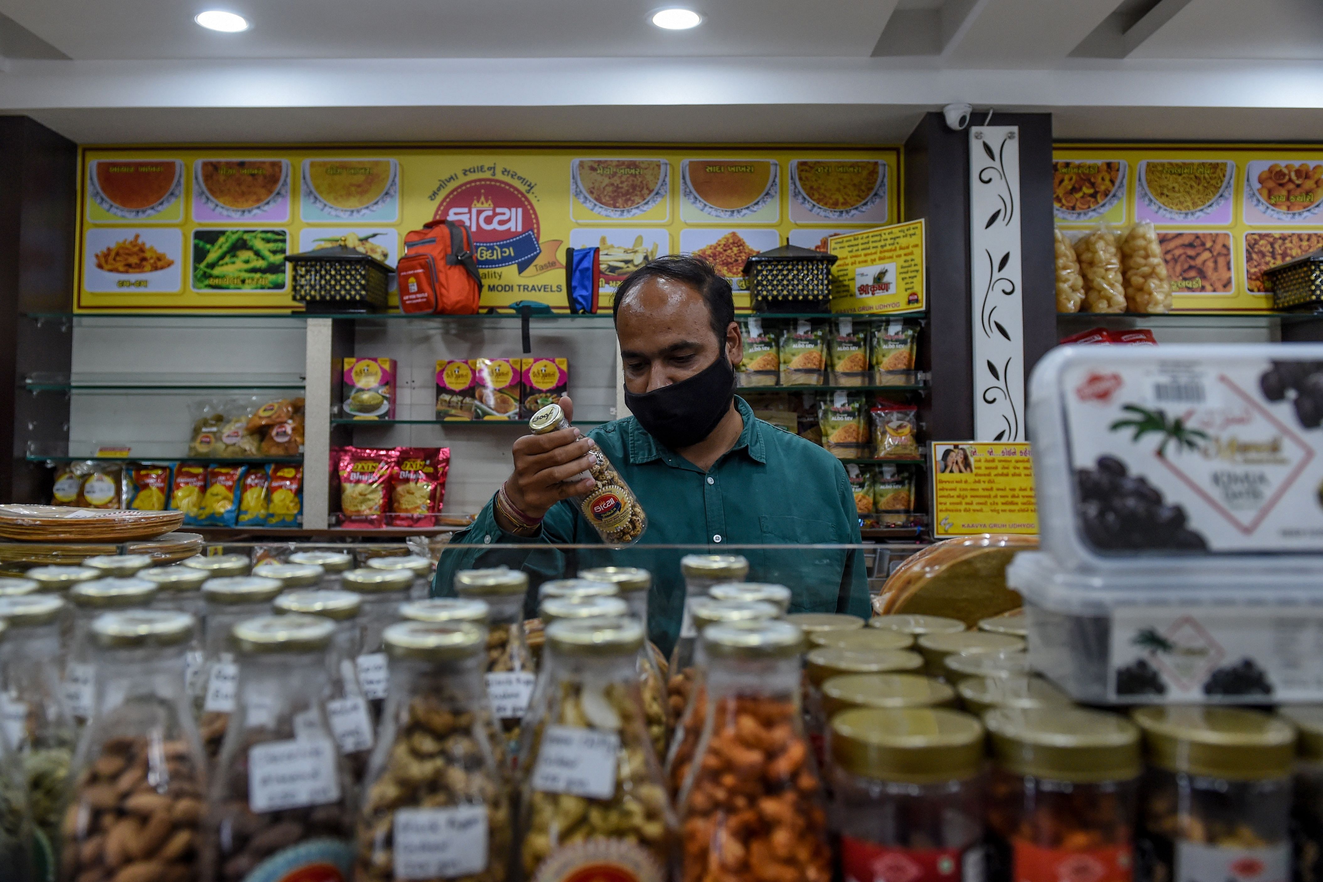 A customer looks at the shelves for shopping. Credits: AFP Photo