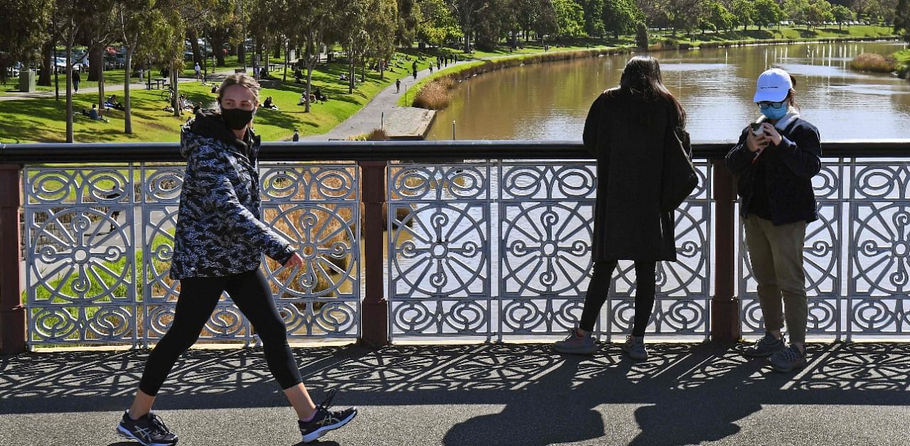People visit a park along the banks of the Yarra River in Melbourne on September 27, 2020 as an overnight curfew in Australia's second-biggest city will be lifted from September 28, almost two months after it was imposed to counter a surging Covid-19 coronavirus outbreak. Credit: AFP Photo