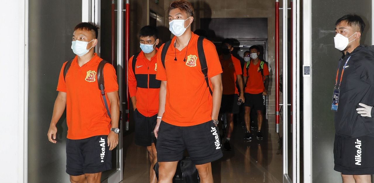 Players and coaching staff from the Wuhan Zall football team arriving in Suzhou, in China's eastern Jiangsu province. Credit: AFP Photo