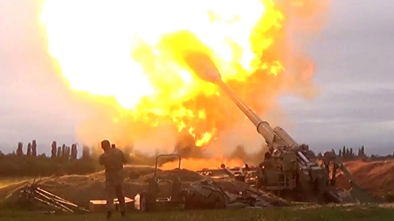 An image grab taken from a video on the official web site of the Azerbaijani Defence Ministry allegedly shows Azeri artillery strike towards the positions of Armenian separatists in the breakaway region of Nagorno-Karabakh. Photo by Handout / Azerbaijani Defence Ministry / AFP.