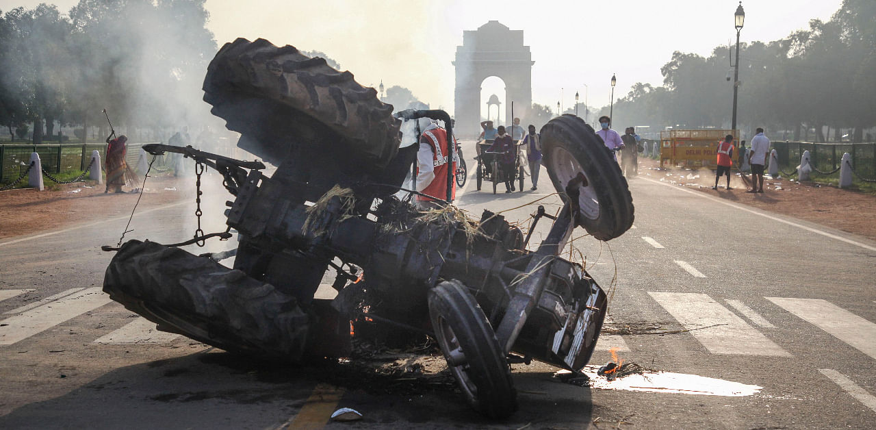 Charred remains of a tractor that was set on fire near India Gate during a protest against the new farm laws, in New Delhi, Monday, Sept 28, 2020. Credit: PTI Photo