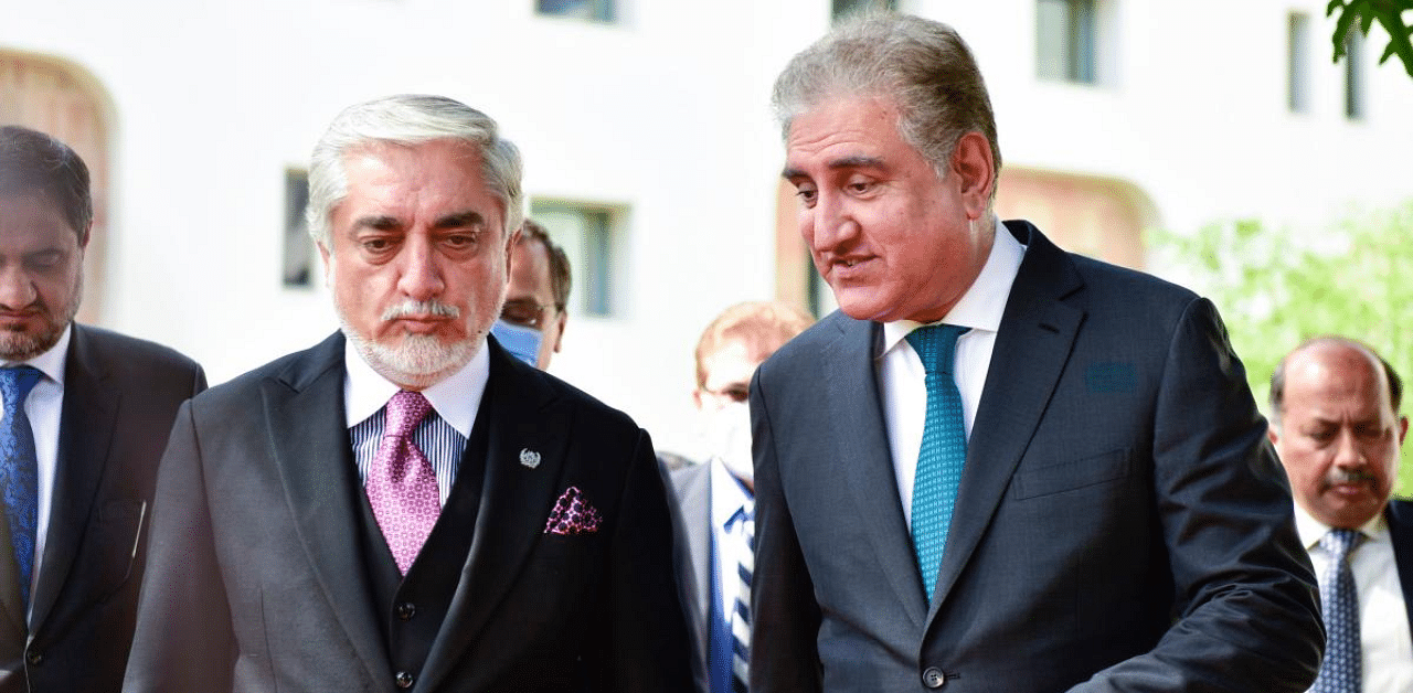 Abdullah Abdullah (2L) listens to the Pakistani Foreign Minister Shah Mahmood Qureshi (R) during his visit at the Ministry of Foreign Affairs in Islamabad. Credit: AFP Photo