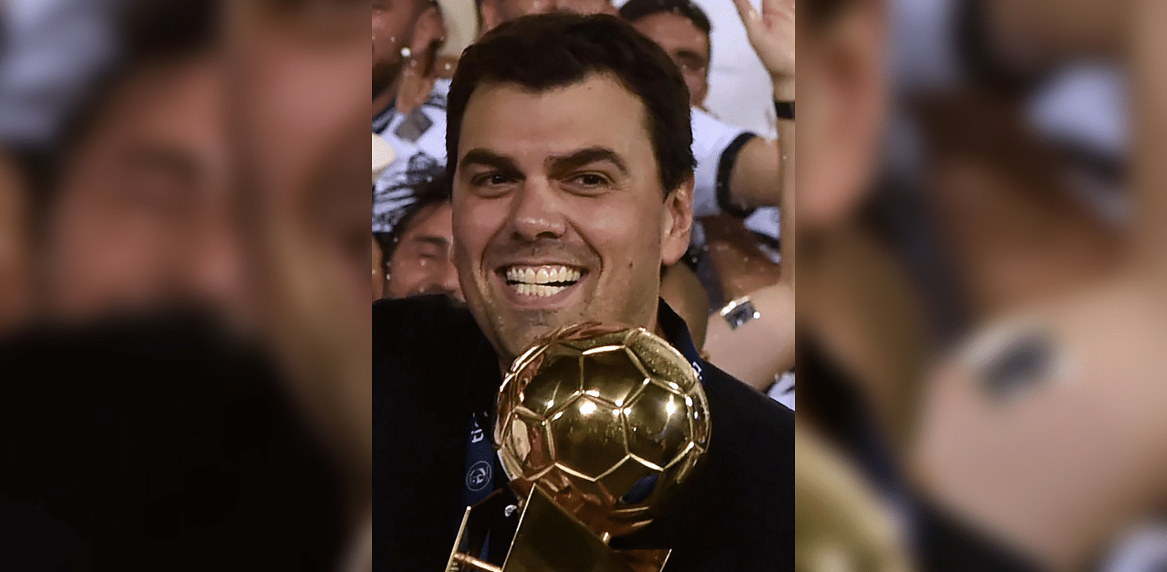 In this file picture taken on May 30, 2018 Olimpia's President Marcos Trovato celebrates with the trophy after the team won the Paraguayan Apertura football tournament at the Defensores del Chaco stadium in Asuncion. Credit: AFP Photo