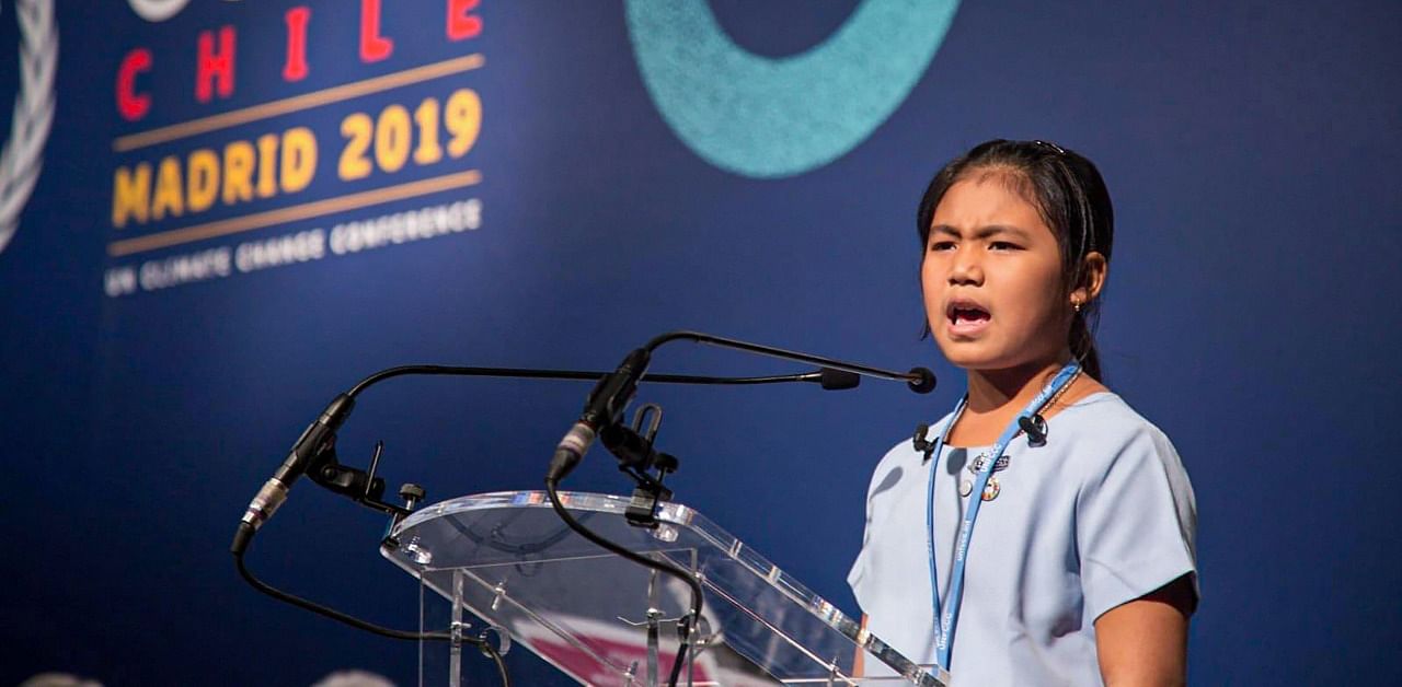 Eight-year-old Licypriya Kangujam from Manipur speaks at the Climate Summit in Madrid, Spain. Credit: PTI Photo