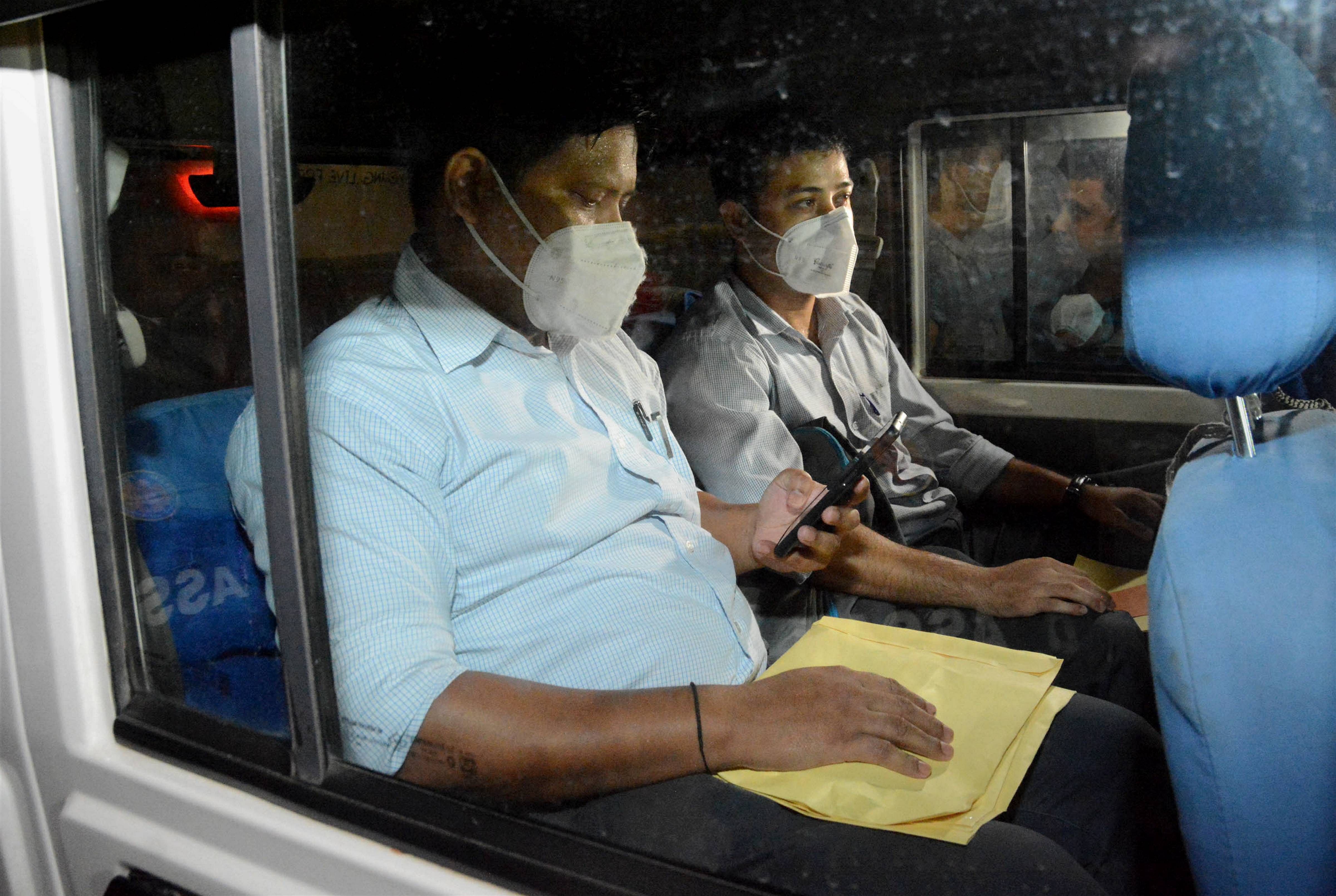 CID officials after conducting a raid at the residence of former Assam Police DIG PK Dutta in connection to his alleged involvement in leakage of question papers, in Guwahati, Thursday, Sept. 24, 2020. Credit: PTI Photo