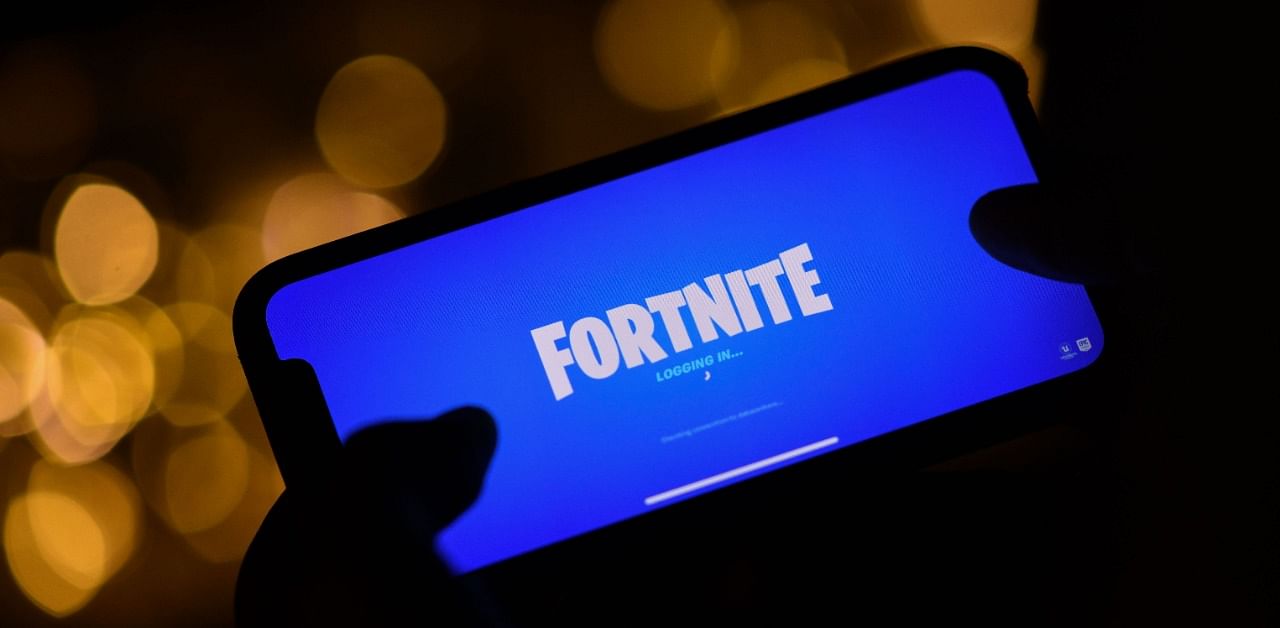 A person logging into Epic Games' Fortnite on their smartphone. Credit: AFP Photo