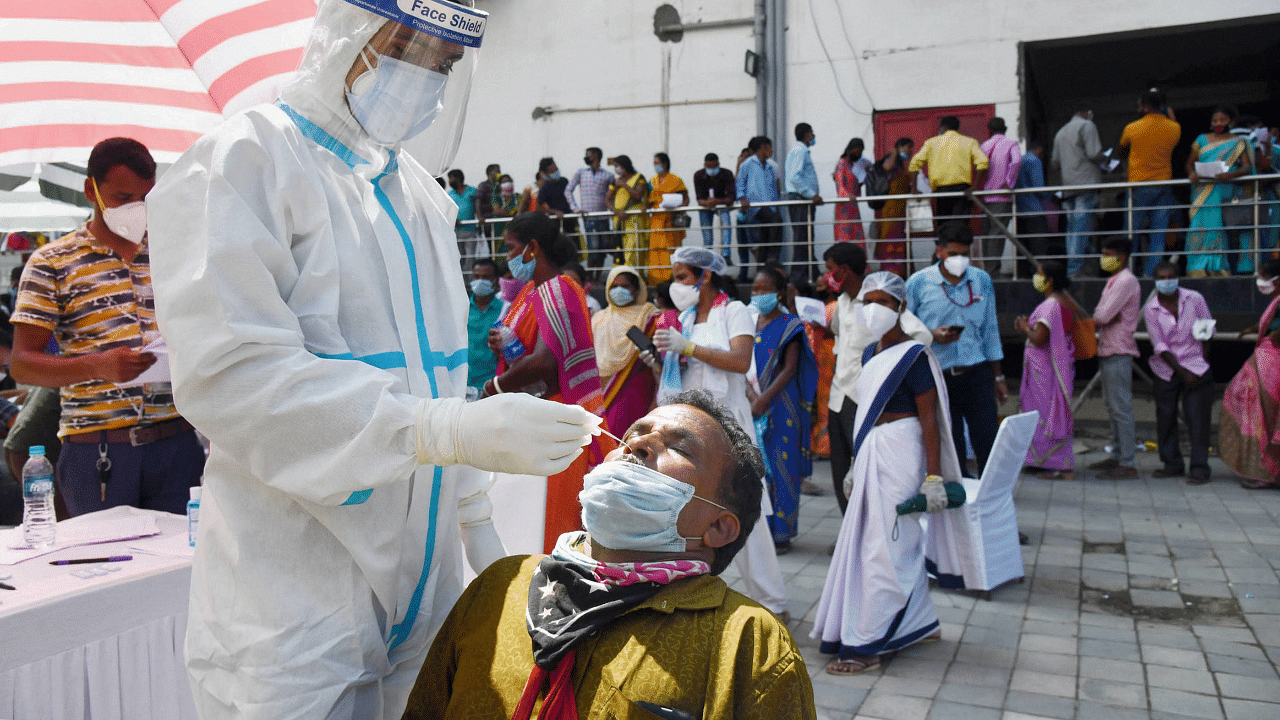  health worker takes samples for Covid-19 Rapid Antigen Test. Credits: PTI Photo