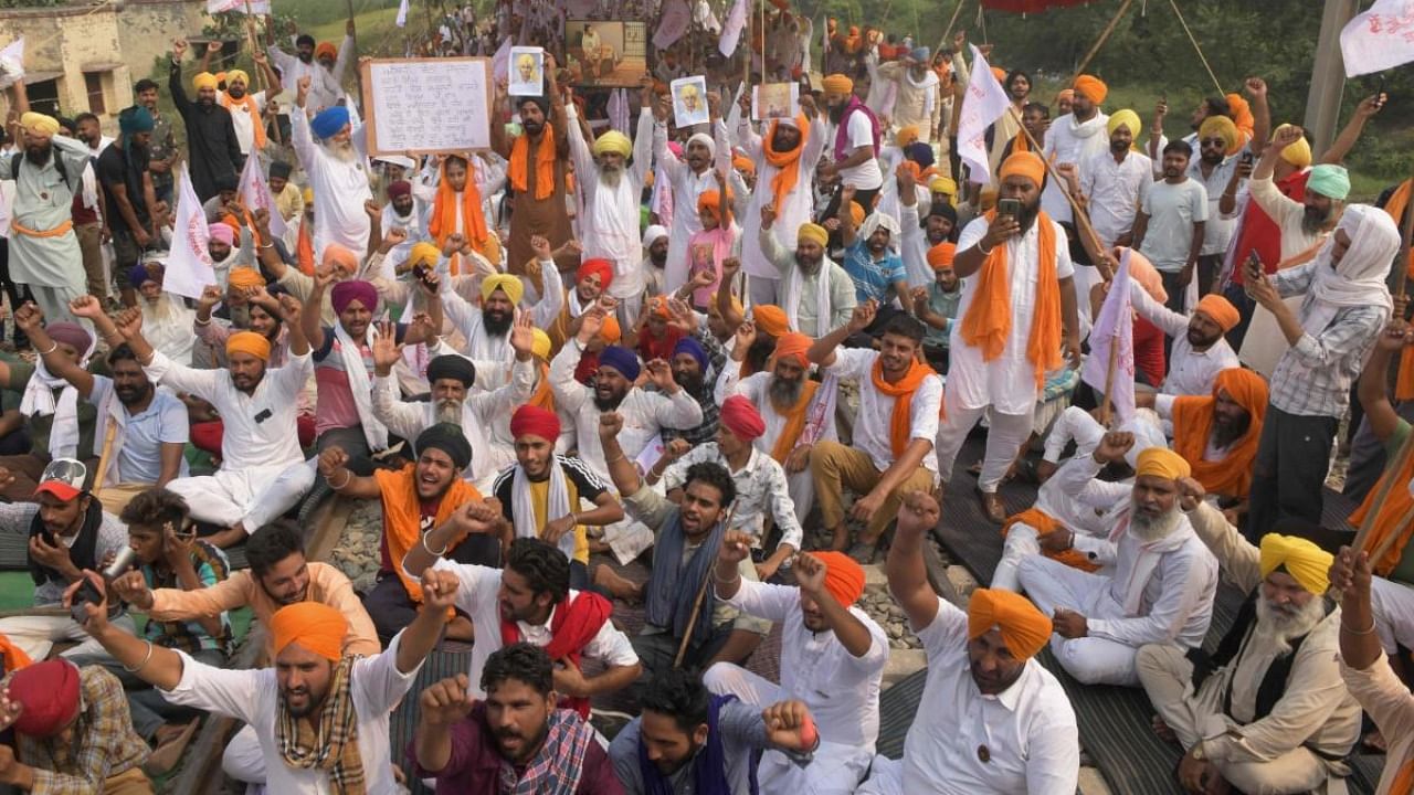Farmers protesting against new farm laws near Amritsar. AFP 