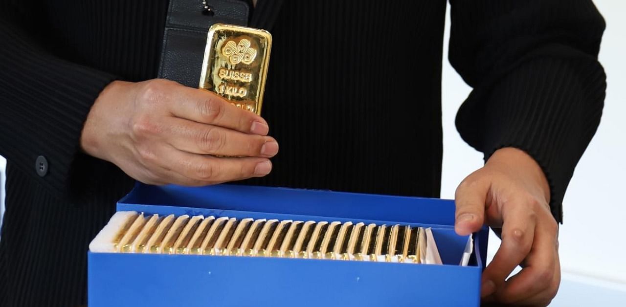 Gold, viewed as a hedge against inflation and currency debasement, has risen over 20% this year, mainly supported by unprecedented stimulus measures by governments and central banks worldwide to revive their coronavirus-battered economies. Credit: AFP