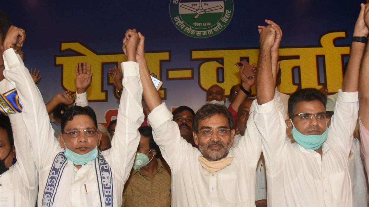 RLSP President Upendra Kushwaha (C) with BSP Bihar in-charge Ramji Singh Gautama (L) and Janwadi party leader Sanjay Singh Chauhan (R) during a joint press conference, ahead of Bihar Assembly elections. Credit: PTI.