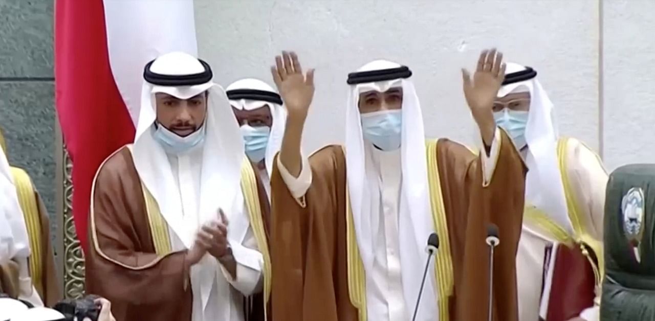 Kuwait's new Emir Nawwaf al-Ahmad al-Sabah gesture as he takes the oath of office at the parliament, in Kuwait City. Credit: Reuters Photo