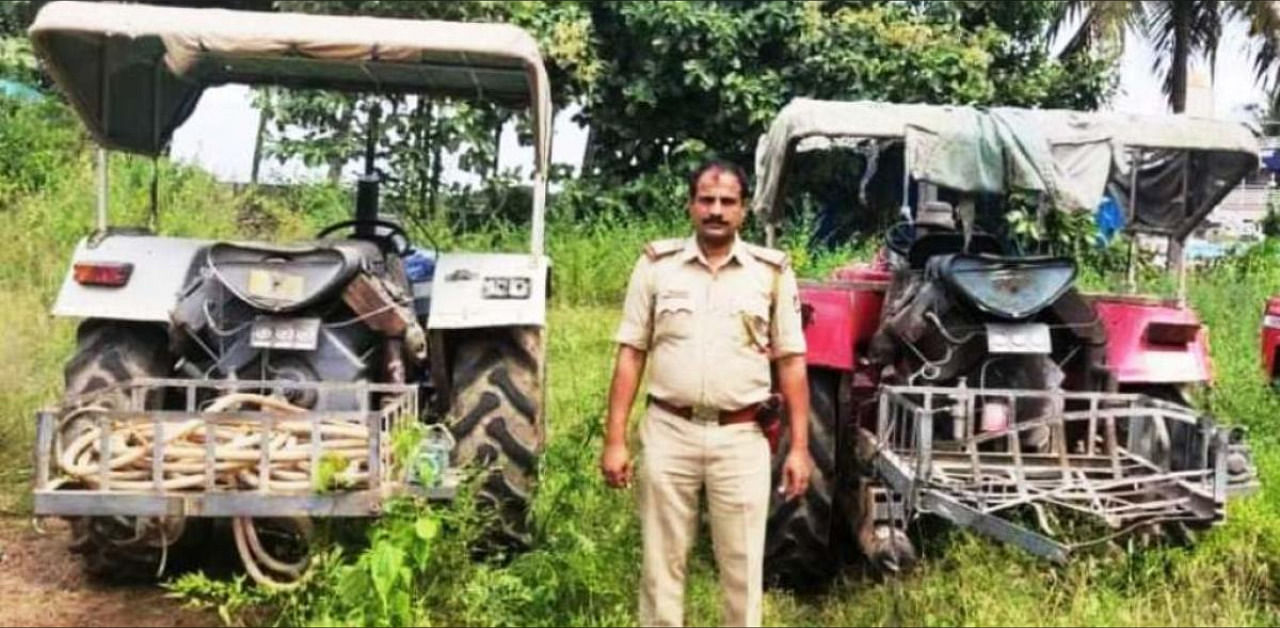 Town police with seized tractors. Credit: DH Photo