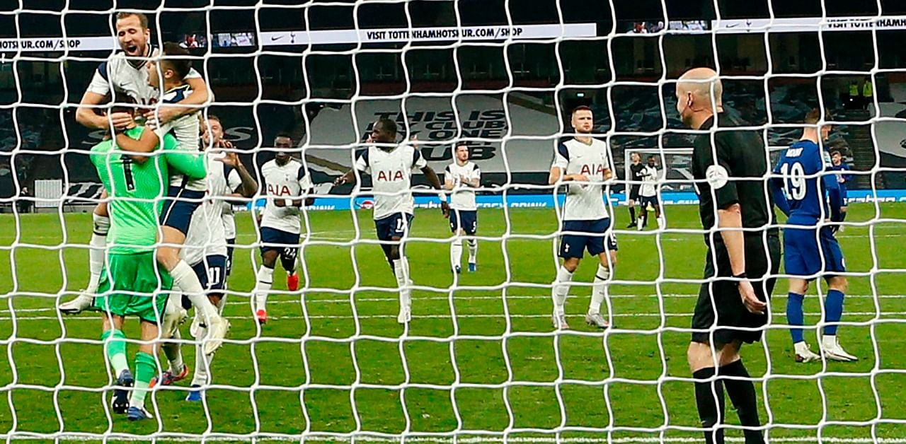 Tottenham Hotspur's English striker players celebrate victory after Chelsea's English midfielder Mason Mount missed his penalty during the English League Cup fourth round football match between Tottenham Hotspur and Chelsea at Tottenham Hotspur Stadium in London. Credit: AFP Photo