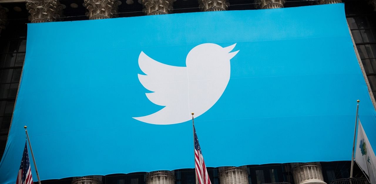 The Twitter logo is displayed on a banner. Credit: AFP Photo