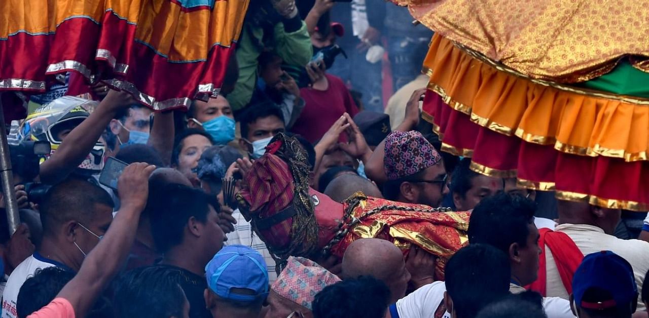 Devotees walk in a procession in Bungamati. Credit: AFP Photo