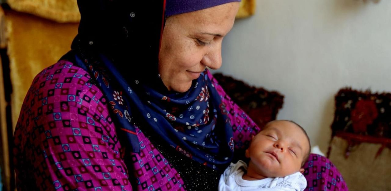 Rima Jassem with her newborn baby. Credit: AFP Photo
