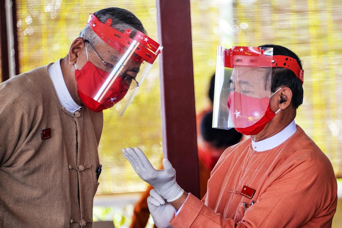 Myanmar's President Win Myint (R) and former president Htin Kyaw (L). Credit: AFP