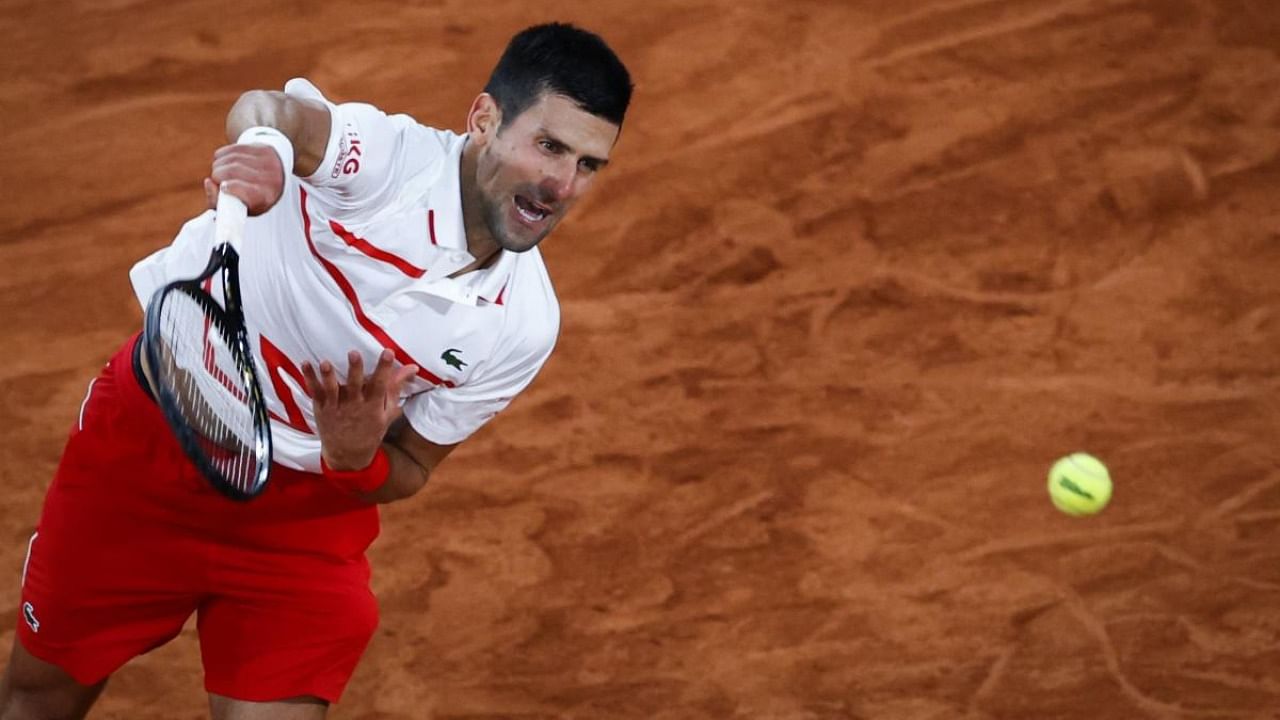 Serbia's Novak Djokovic serves the ball to Sweden's Mikael Ymer during their men's singles first round tennis match at the Philippe Chatrier court on Day 3 of The Roland Garros 2020 French Open. Credit: AFP.