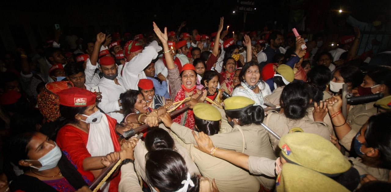 Samajwadi Party women wing workers clash with police personnel during their protest over the death of the Dalit woman from Uttar Pradesh's Hathras. Credit: PTI Photo