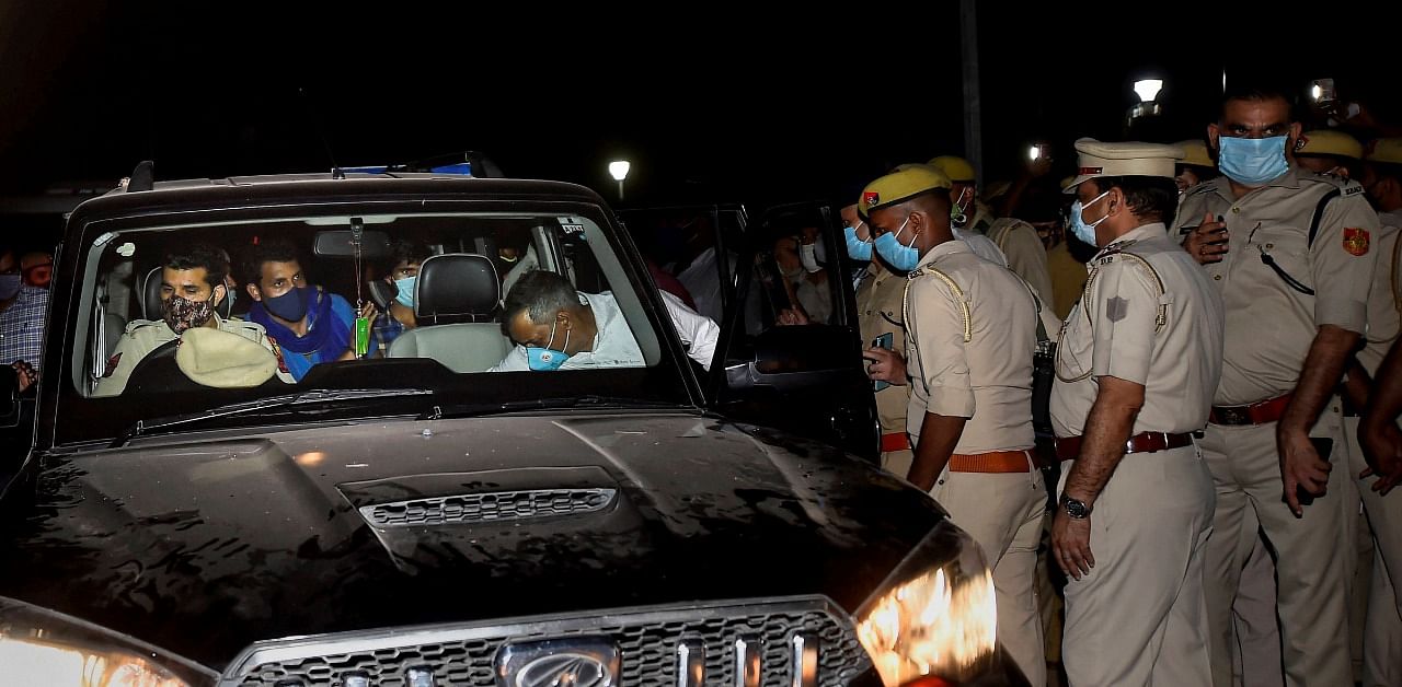 Bhim Army Chief Chandrashekhar Azad with the father of Hathras rape victim, leave in a car from Safdarjung hospital, in New Delhi. credit: PTI Photo