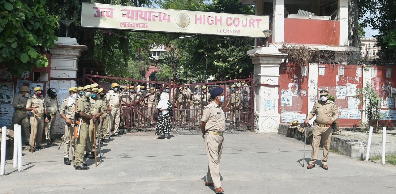 Police stand guard outside a special CBI court during pronouncement of its judgement of those accused in 1992 Babri mosque demolition case, in Lucknow. Credit: PTI Photo